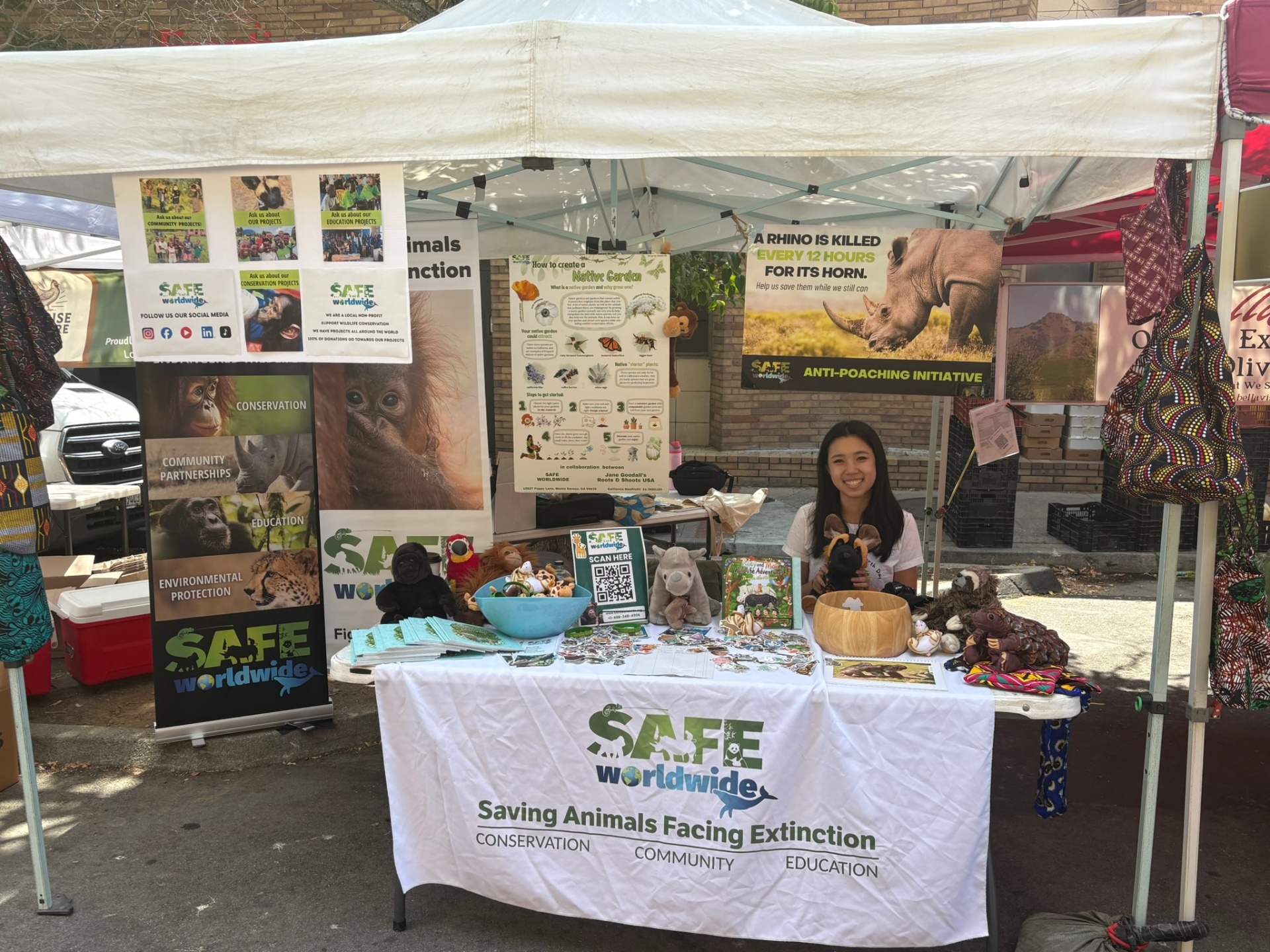 Volunteering at the SAFE Worldwide booth at the Los Gatos Farmers' Market